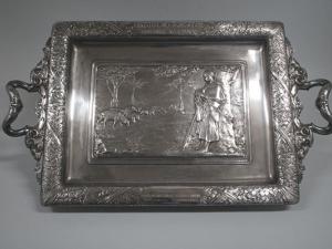 Plateau à anses en métal argenté, décoré par un relief représentant une bergère avec son troupeau de moutons. 