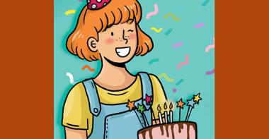 Une petite fille souriante tien gâteau d'anniversaire devant elle